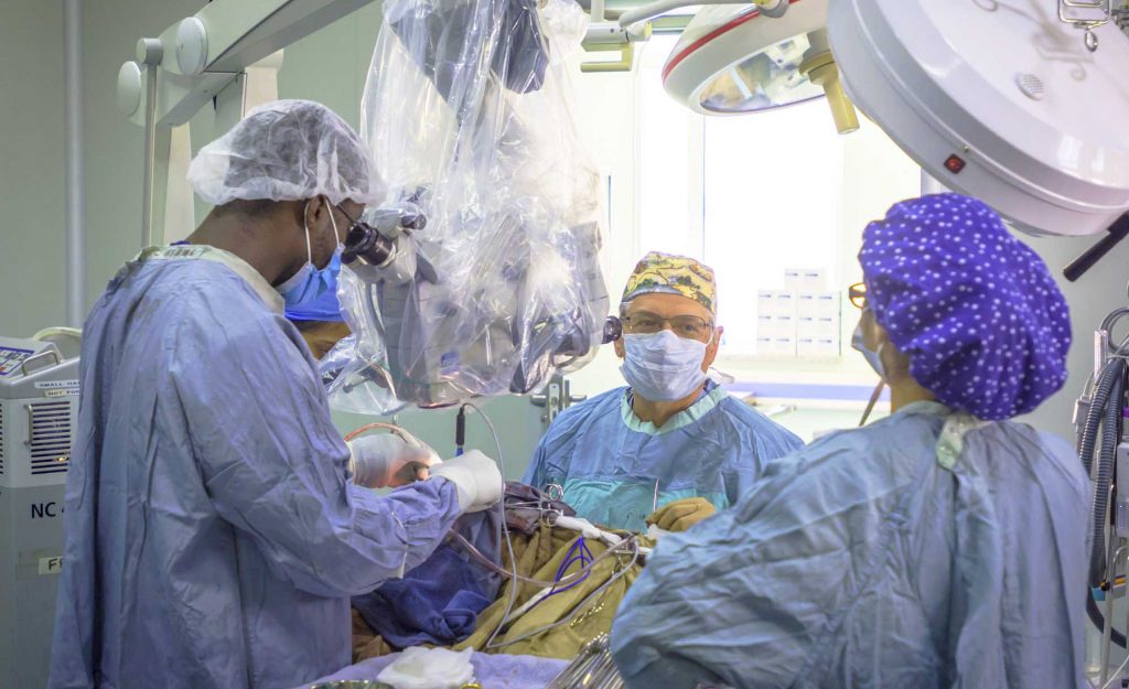 KBNF Neurosurgeons using a neurosurgical microscope, donated from North America, in West Africa